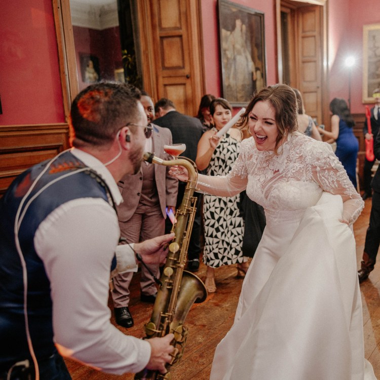 Paul Haywood (Paulonsax) performing an energetic saxophone set at a luxury wedding reception at Bocconoc House, Cornwall. The bride and guests dance and celebrate in an immersive live performance alongside DJ FistralStereo. Photography by Nick Walker Photography.