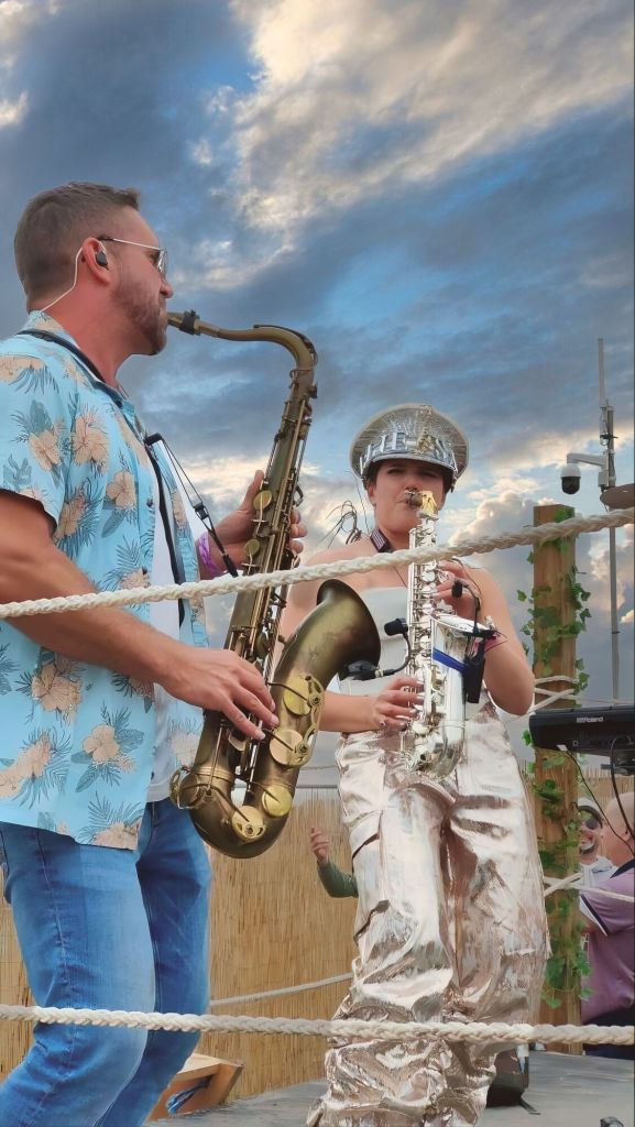Paul Haywood and Ellie Sax performing a live saxophone duo set at Tunes in the Dunes festival. A surprise guest collaboration after Ellie’s main stage performance, creating one of the festival's biggest highlights