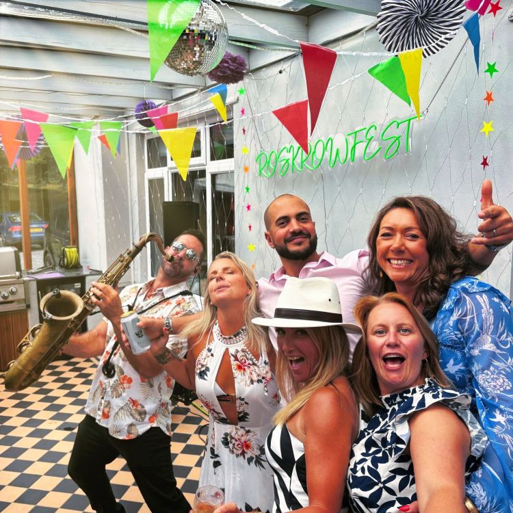 Paul Haywood performing live saxophone at a private birthday party in Falmouth, Cornwall. A fun and energetic celebration with dancing, music, and party vibes.